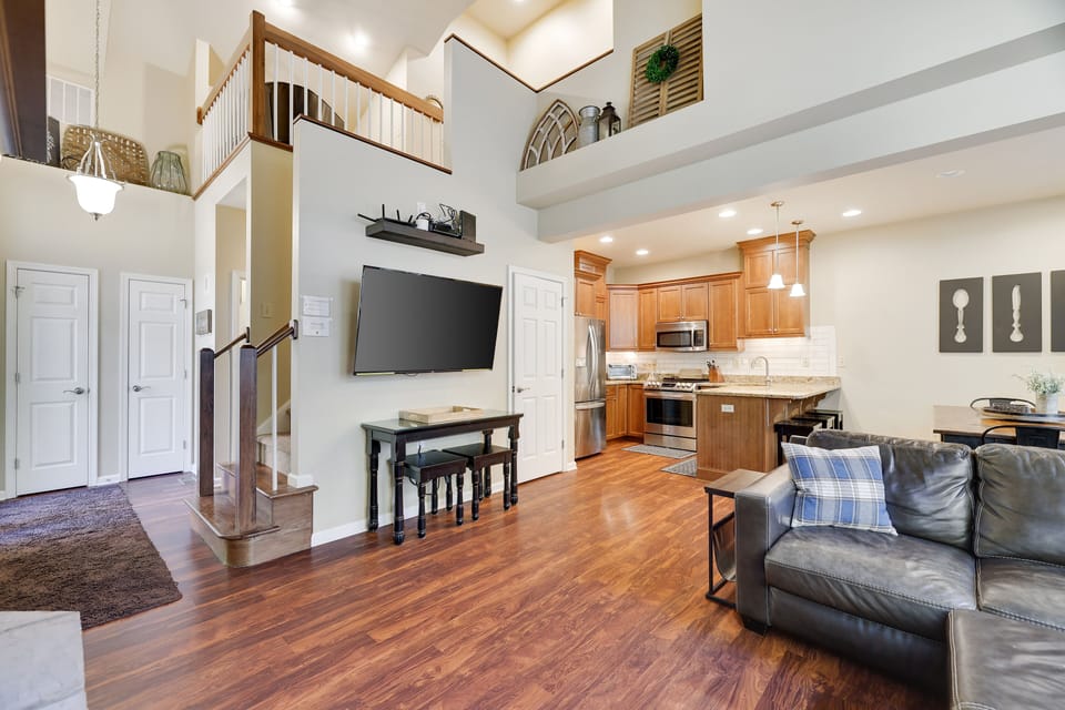 Main floor living view to the balcony and into kitchen 