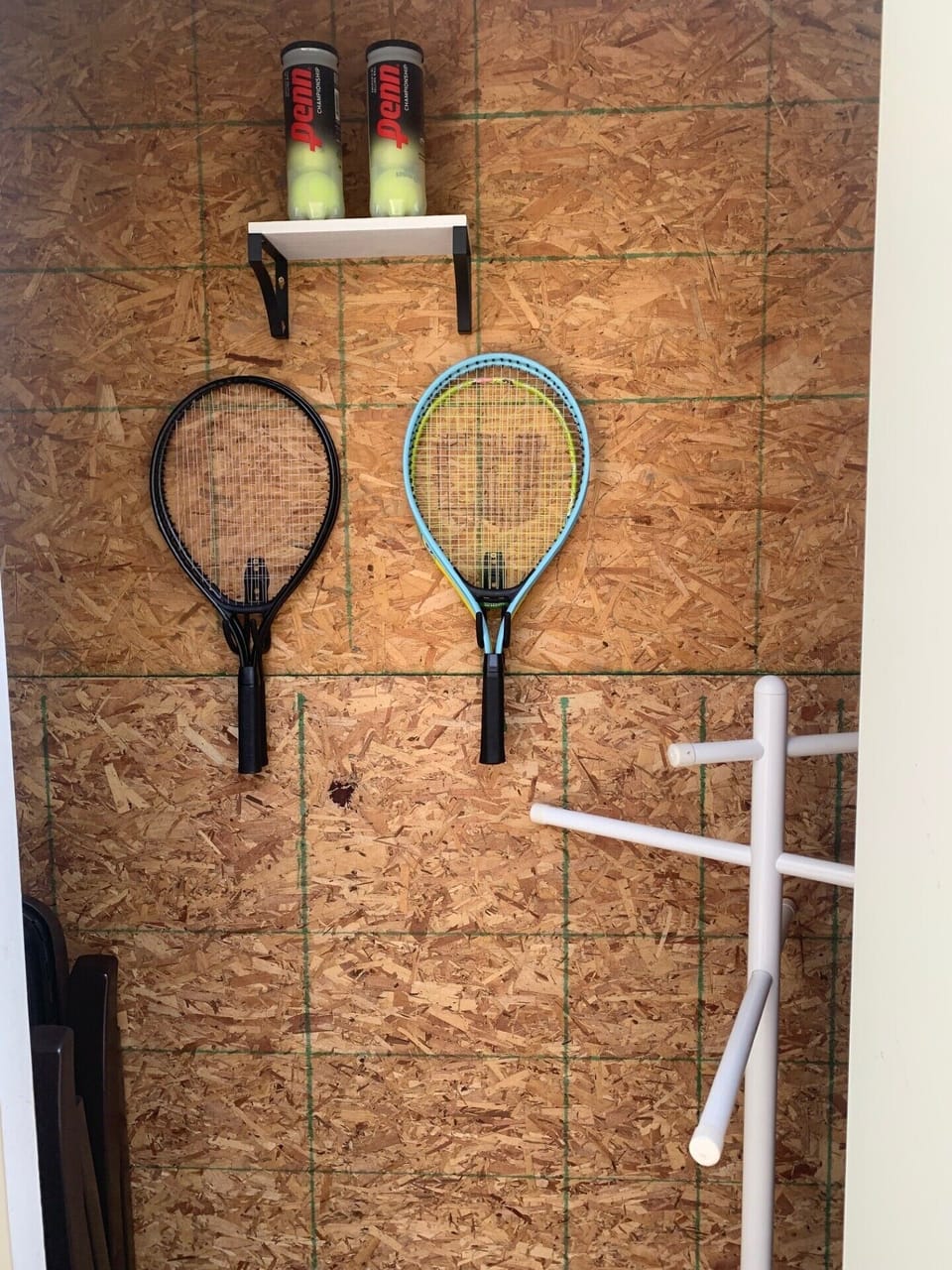 Pickleball ready for you in the front porch closet