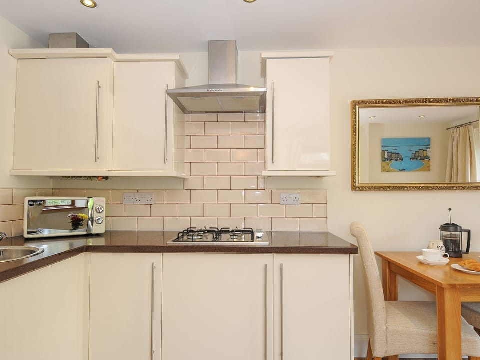 Fridge, electric kettle, cookware/dishes/utensils