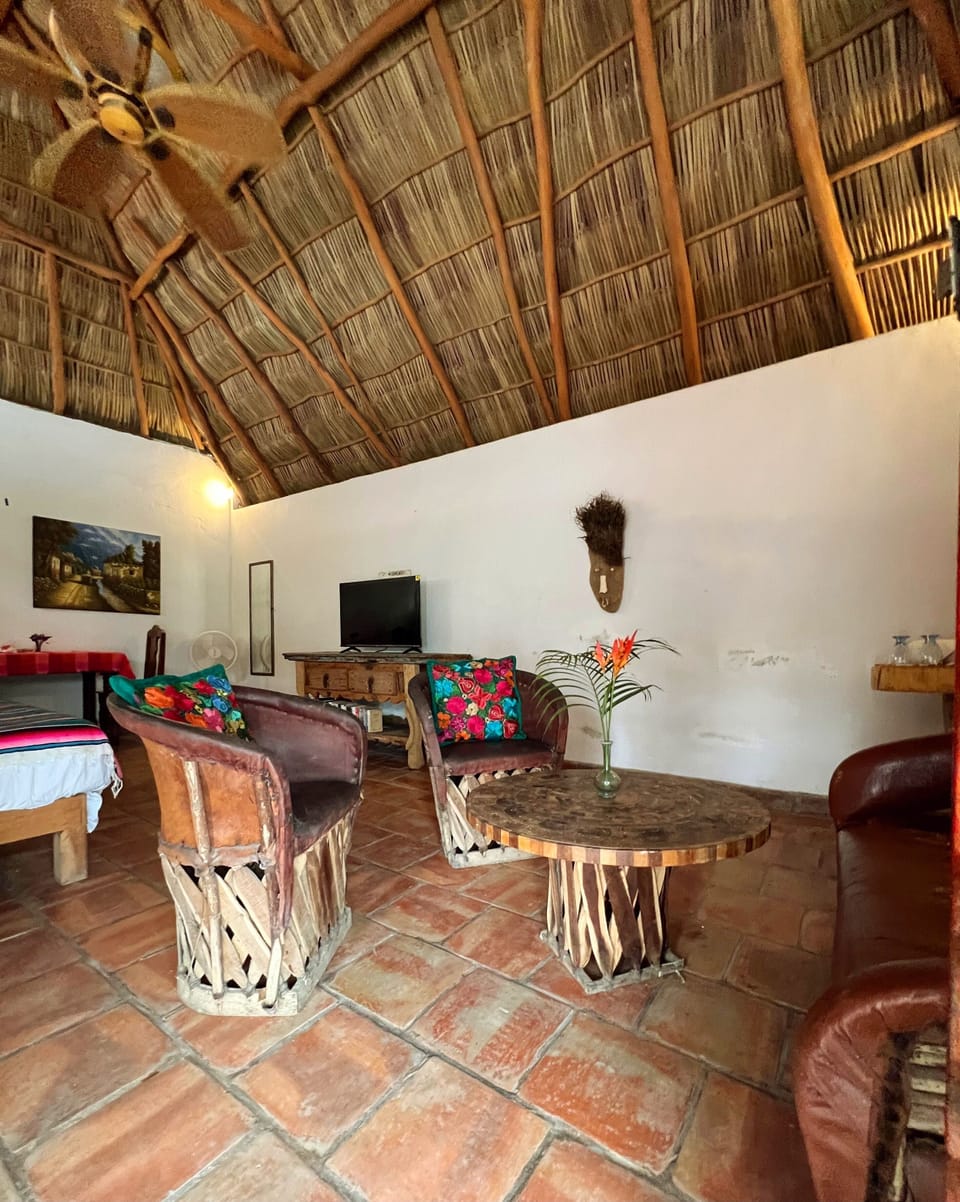 Palapa has living, dining and sleeping areas.