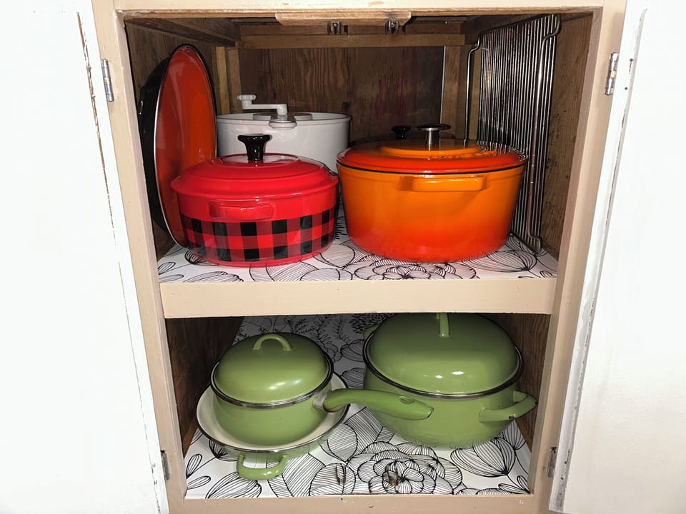Dutch oven, enameled pots, salad spinner and strainer, cooling rack.