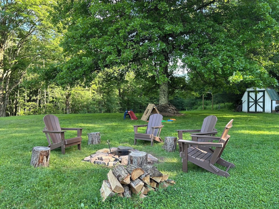Lush and green in the summer with a shaded play area under the oak tree. 