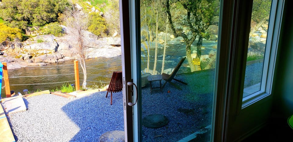 Living room 1 -You can sit on the sofa & enjoy the views and sounds of the River
