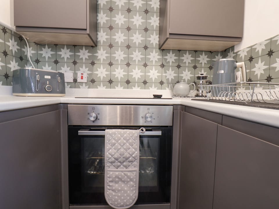 Fridge, electric kettle, toaster, cookware/dishes/utensils