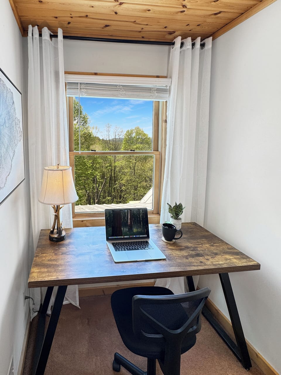 This queen bedroom features a dedicated desk and workspace—perfect for remote work or creative time. Enjoy the comfort of a quiet, private room with cozy bedding and a functional setup for staying productive during your stay.