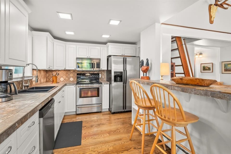 Renovated, fully-equipped kitchen with updated appliances.