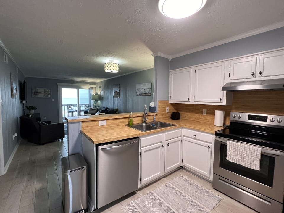 Full kitchen with cooking utensils and dishes