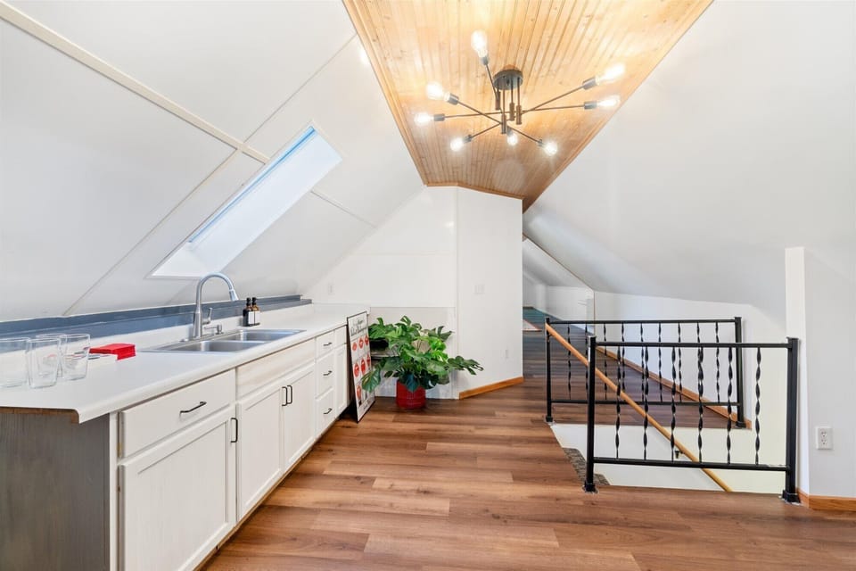 Loft style area in the beverage area with chandelier