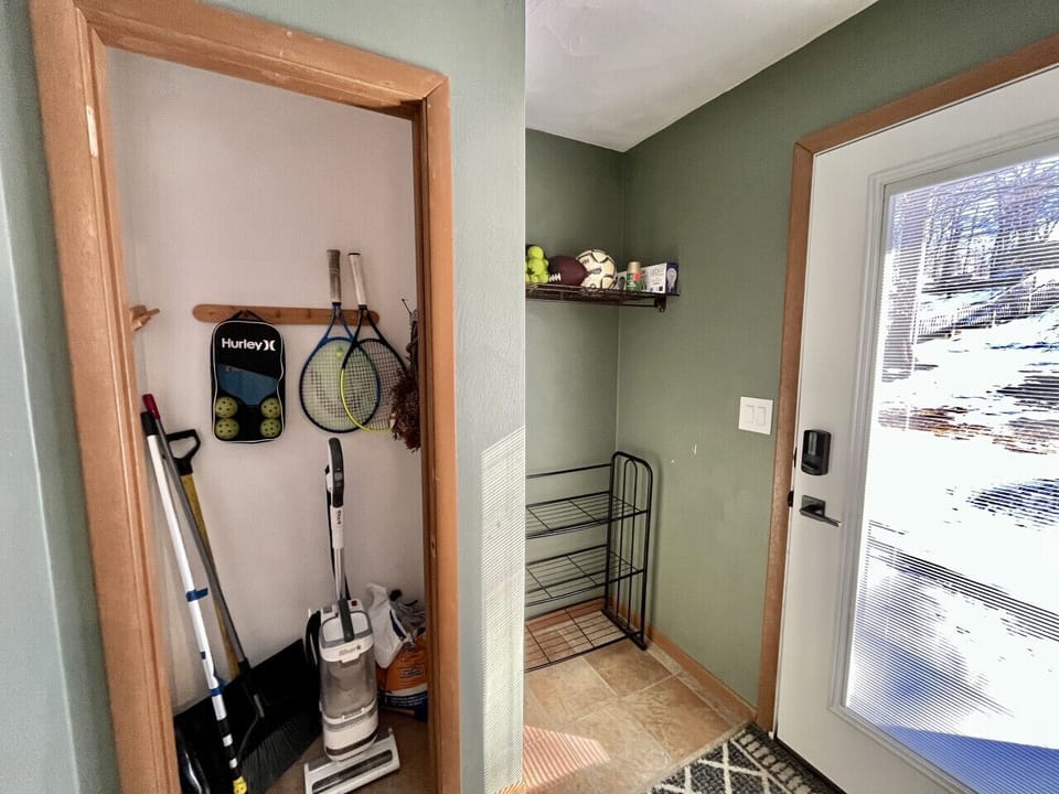 Spacious mudroom with shoe and ski racks