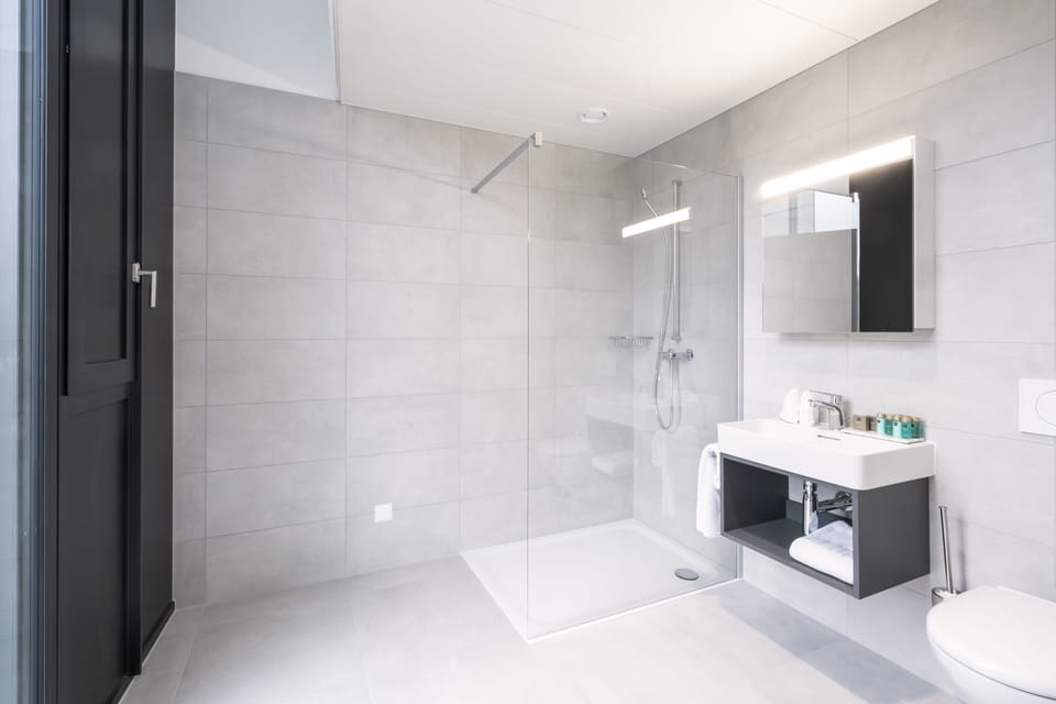 Superior Room | Bathroom | Shower, hair dryer, bathrobes, slippers