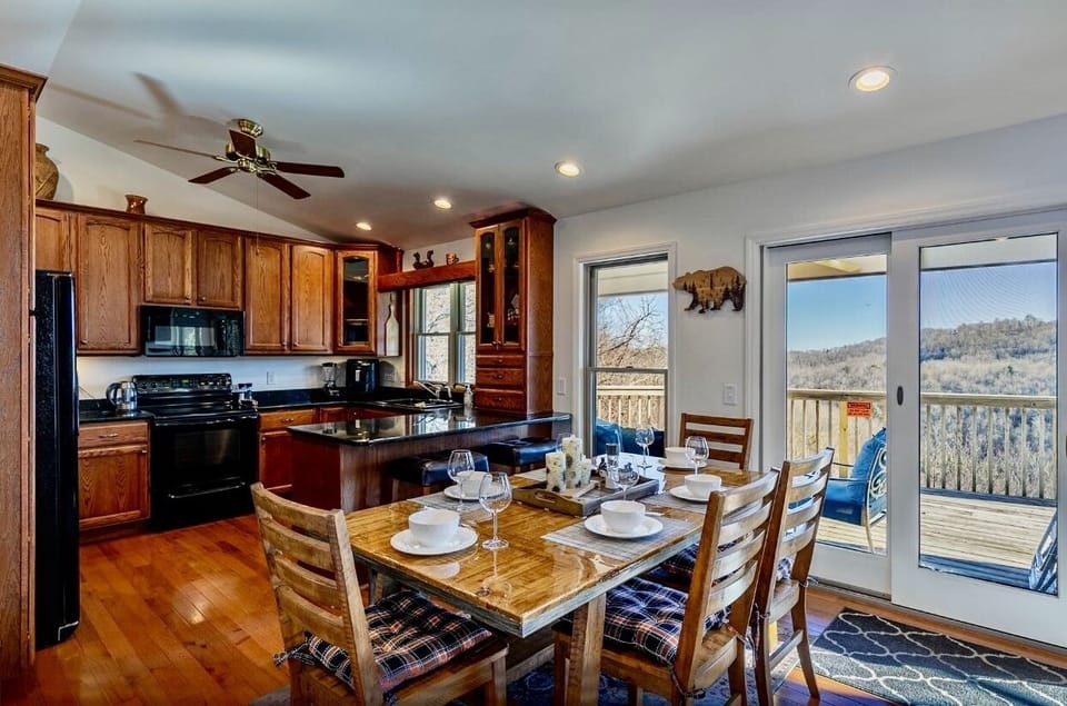 Dining table for 6-8, 2 barstools;  the area is connected to kitchen with beautiful Mountain View 