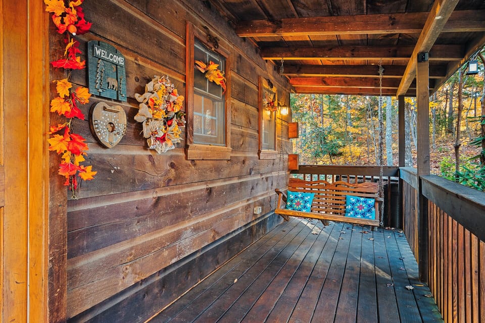 Share magic moments and sip coffee on Beary Tale's front porch loveseat.