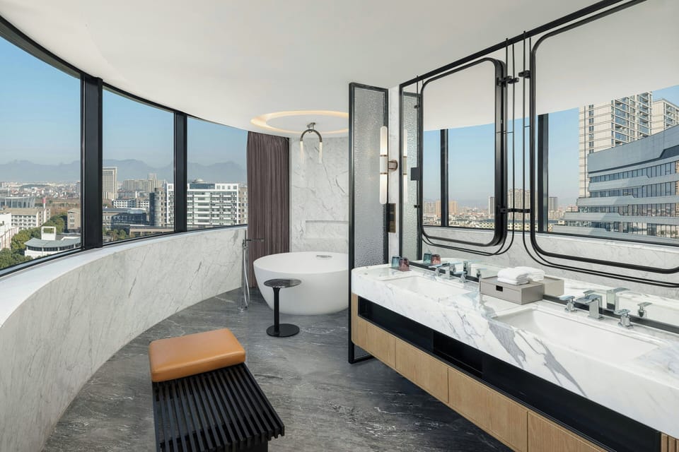 Separate tub and shower, rainfall showerhead, hair dryer, bathrobes