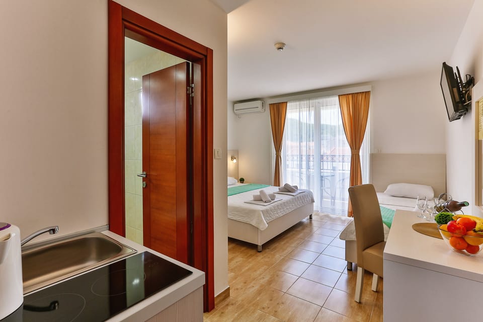 Triple Room, Balcony, City View | Minibar, in-room safe, free WiFi
