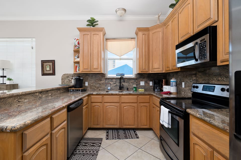 The fully equipped kitchen has everything you need for family meals, coffee, or quick beach snacks