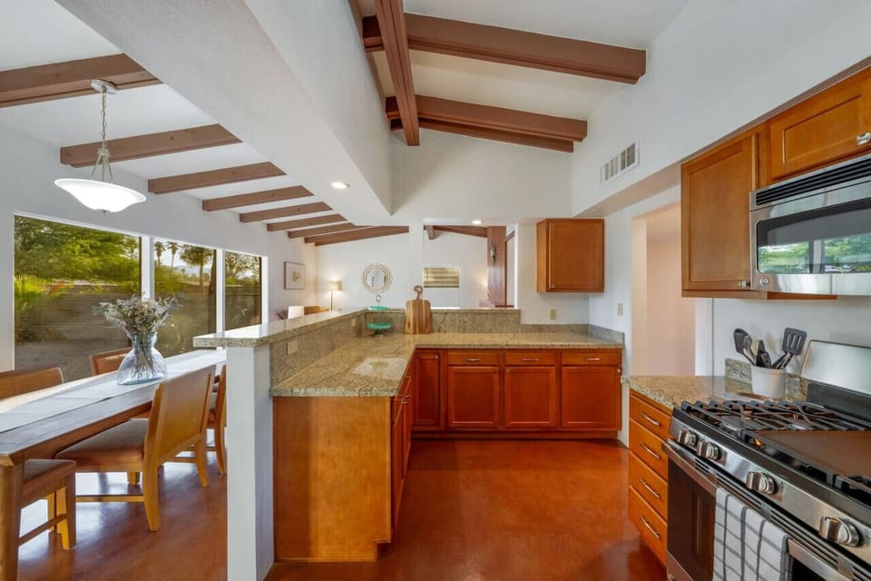 View of the well-appointed kitchen, dining area, and living room