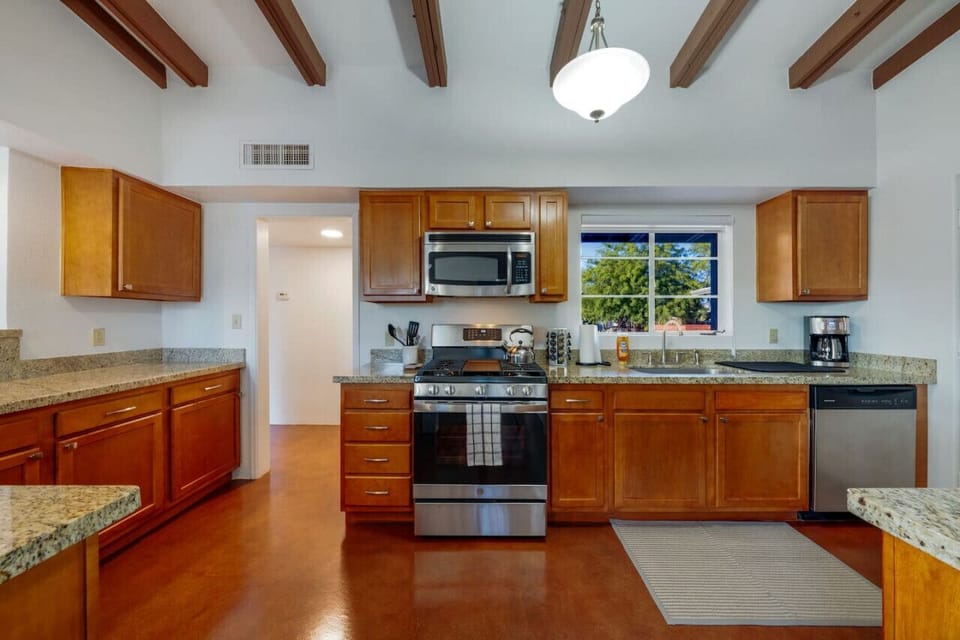 Updated, well-appointed kitchen with granite countertops, gas stove and oven