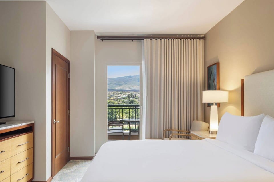 Primary Bedroom features a king bed and ensuite full bathroom (Island View - View May Vary).
