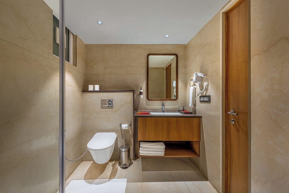 Deluxe Room | Bathroom | Hair dryer, slippers, bidet