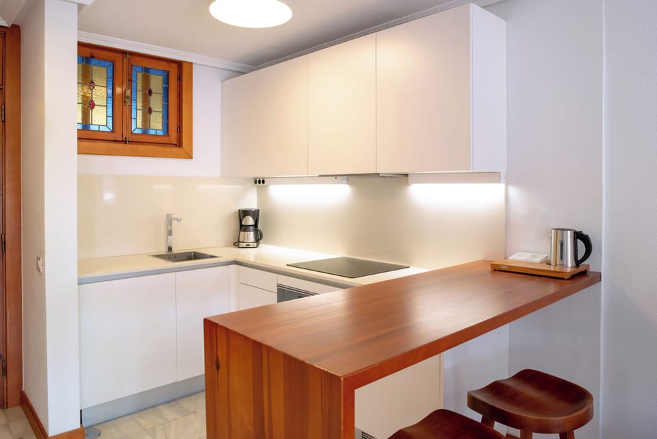 Mini-fridge, microwave, stovetop, coffee/tea maker