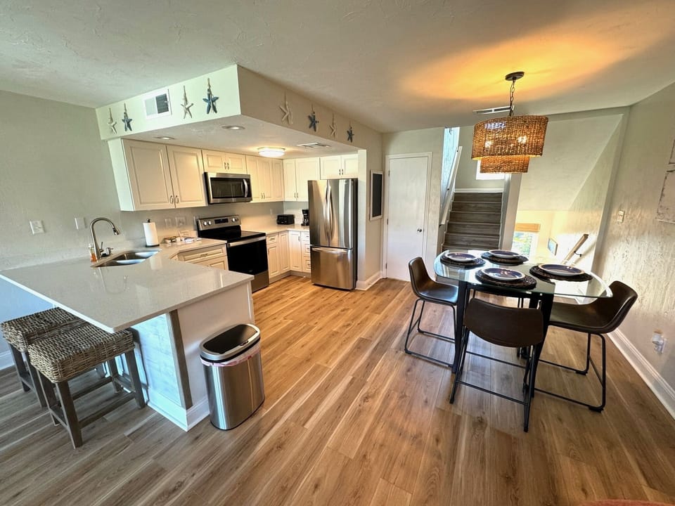 Fully equipped kitchen with stainless steel appliances.