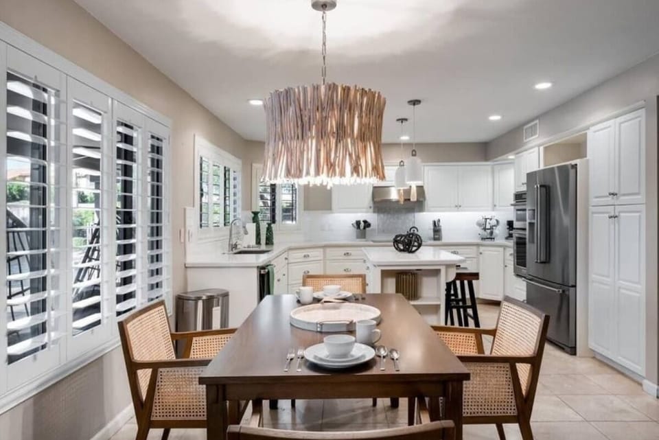 Gather around this bright, fully-equipped kitchen with an elegant dining space where your group can cook together and share memorable meals in style.