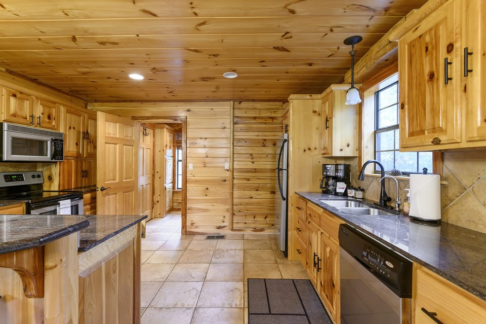 The fully stocked kitchen boasts modern appliances and ample counter space.