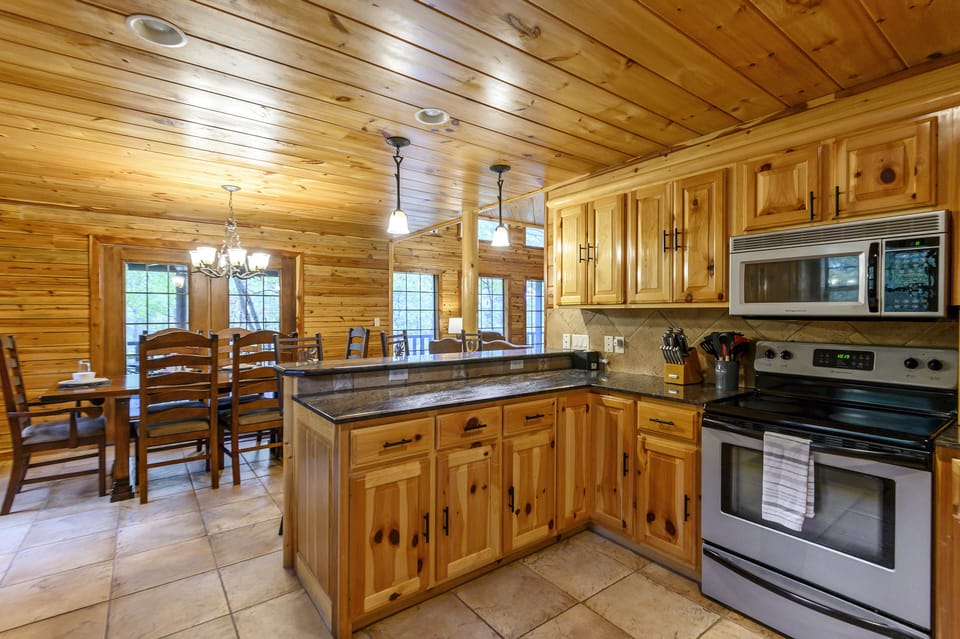 This rustic and efficient kitchen holds everything you need to prepare and cook your meals.