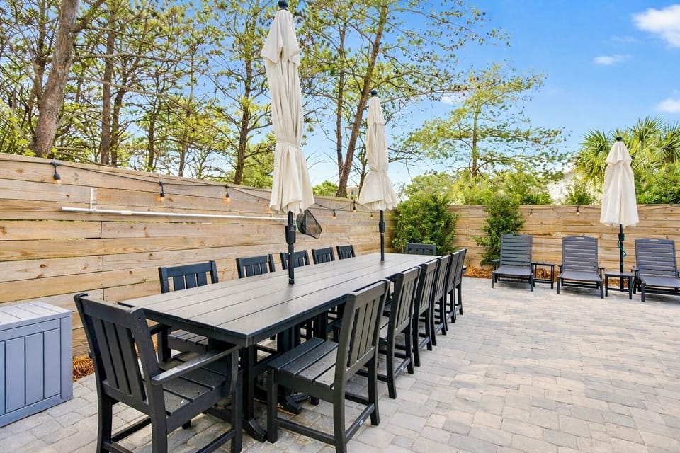 Private backyard oasis with heated pool, hot tub, lounge chairs, hammock, grill, and outdoor dining table!