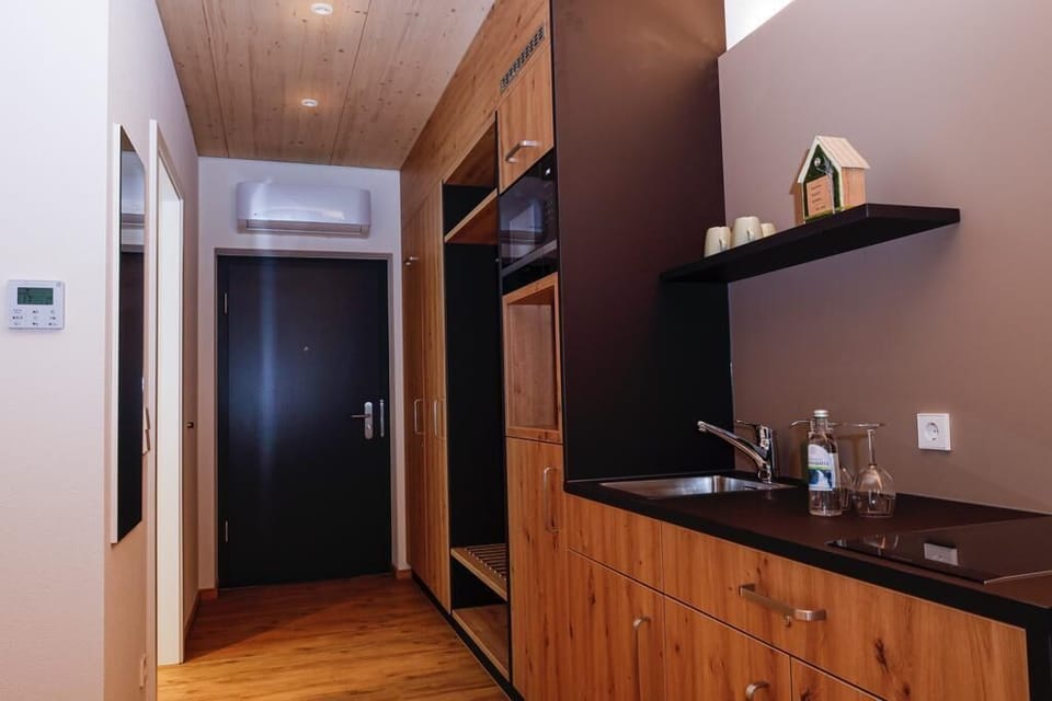 Business Apartment, 1 King Bed, Accessible | Living area | 50-inch Smart TV with satellite channels, computer monitors