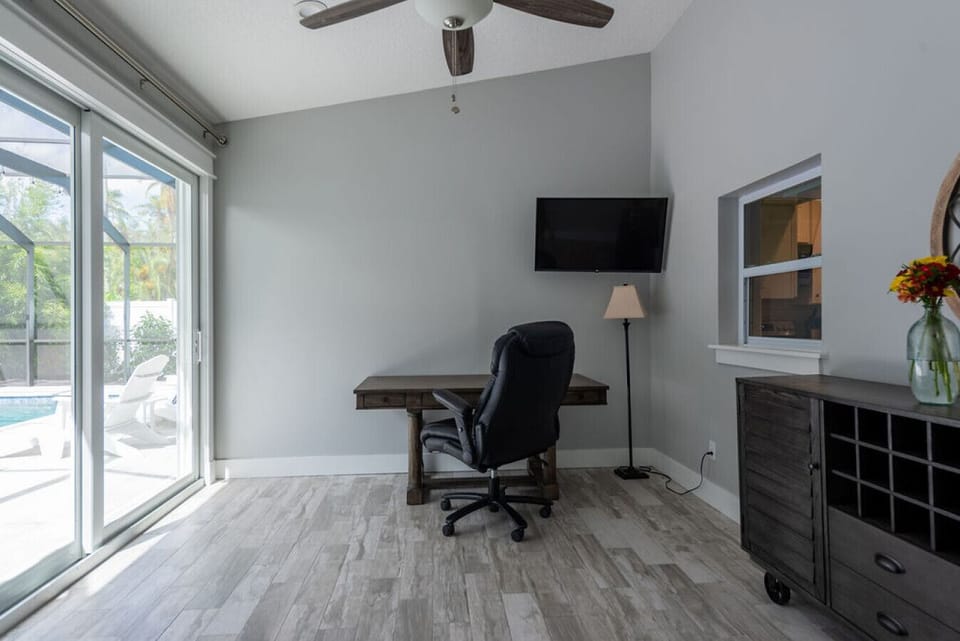 The large office space leads to the pool and also provides space for the provided inflatable queen size mattress