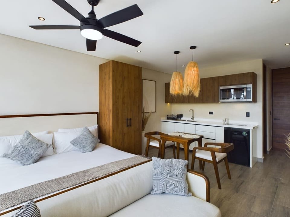 Spacious studio-style living: king bed, kitchen, dining & full bath.