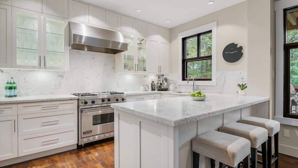 - Modern chef's kitchen with marble countertops  
- High-end appliances and bright natural lighting  
- Perfect Whistler chalet for gourmet cooking stays  
