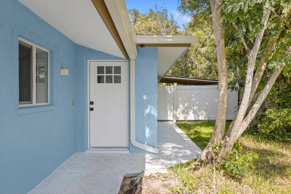 Front Door and Patio Access to Right