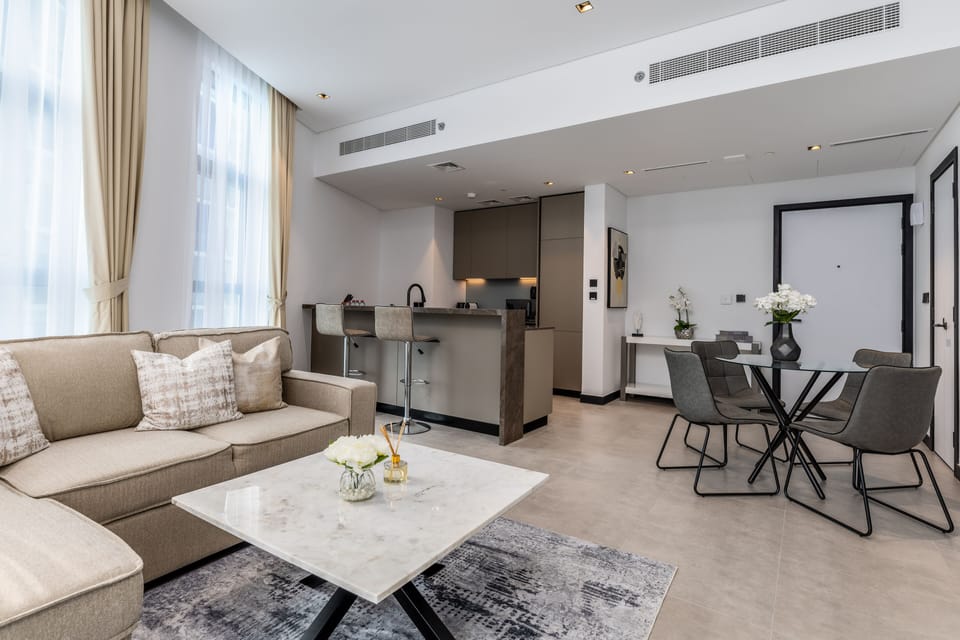 Deluxe Apartment | Living area | 65-inch Smart TV with cable channels, Netflix, streaming services