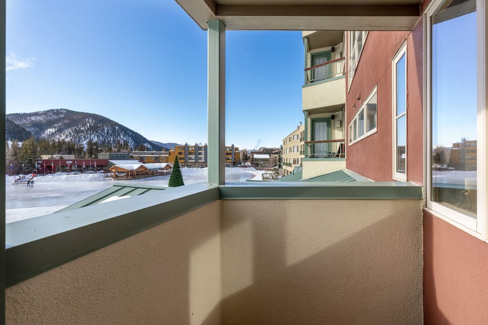Take in panoramic winter mountain views from your private balcony, where snow-capped peaks and charming village life create the perfect alpine backdrop.