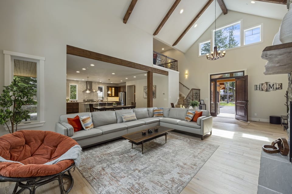Vaulted beam living room — natural light and open flow for groups of 16