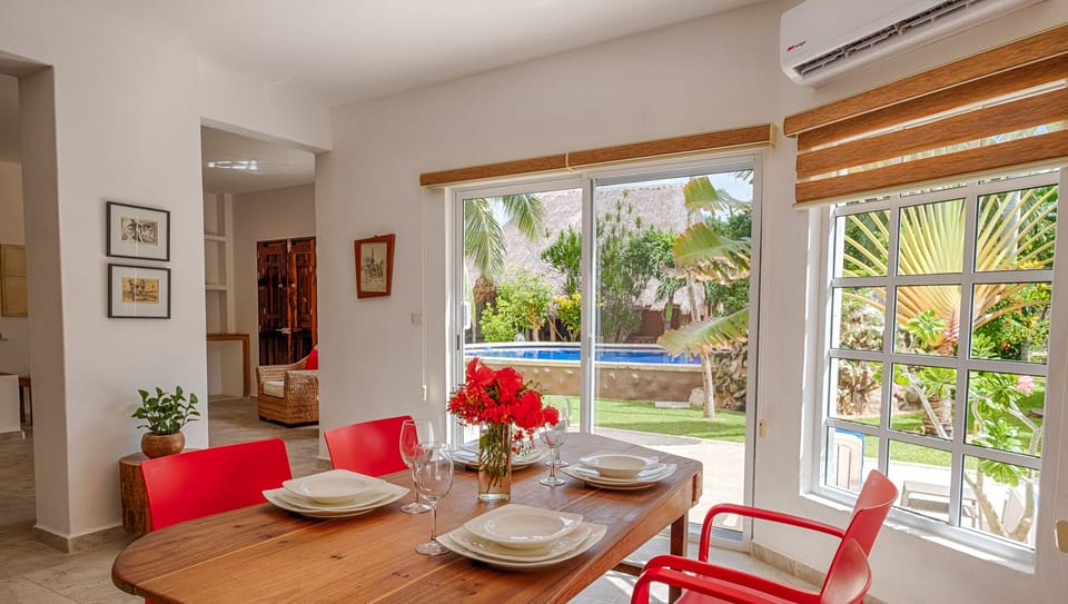 Dining Area with Garden and Pool Views