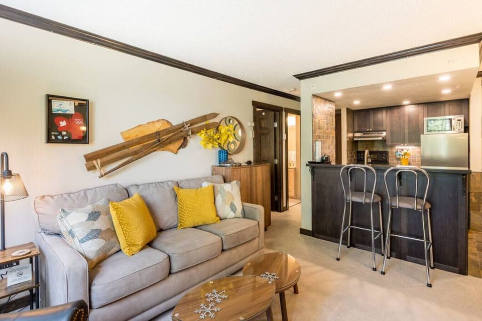 Make family memories here in this cozy layout with breakfast bar and dining table.