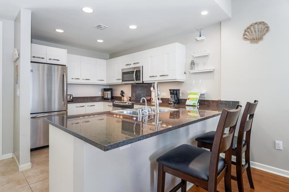 Full kitchen with granite countertops and stainless steel appliances