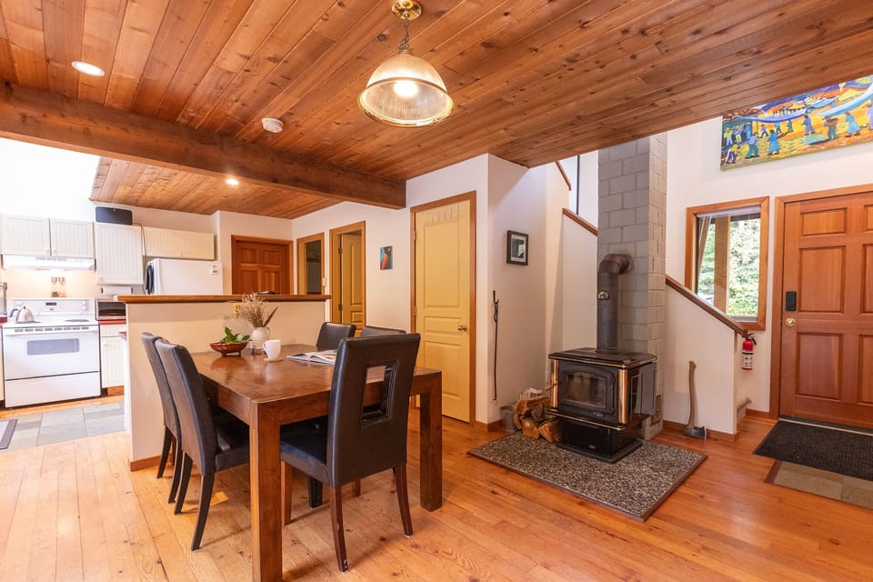 Dining table beside a wood burning oven