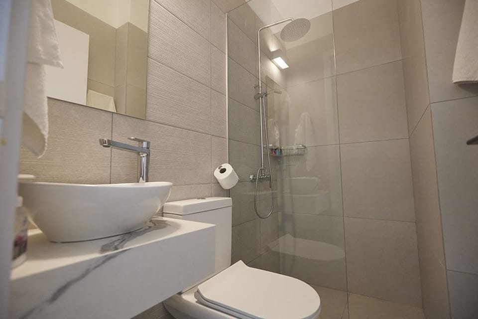 Bathroom 4, lower ground floor with shower and WC