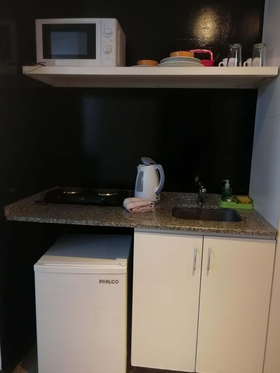Mini-fridge, microwave, electric kettle, cookware/dishes/utensils
