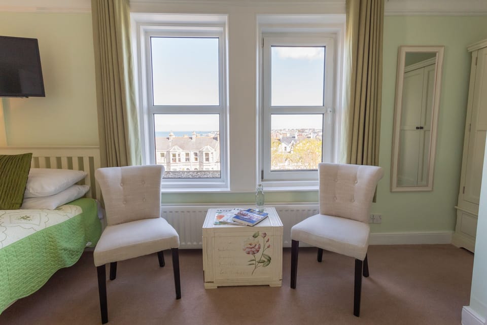 Deluxe Room, Ensuite, Sea View | Desk, blackout drapes, iron/ironing board, free WiFi