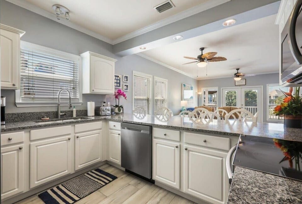Well-equipped kitchen with granite counters and stainless appliances. 