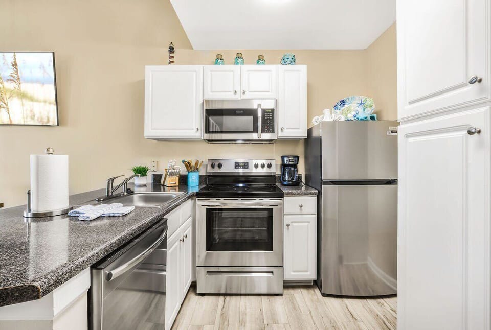 Well-equipped kitchen with stainless appliances