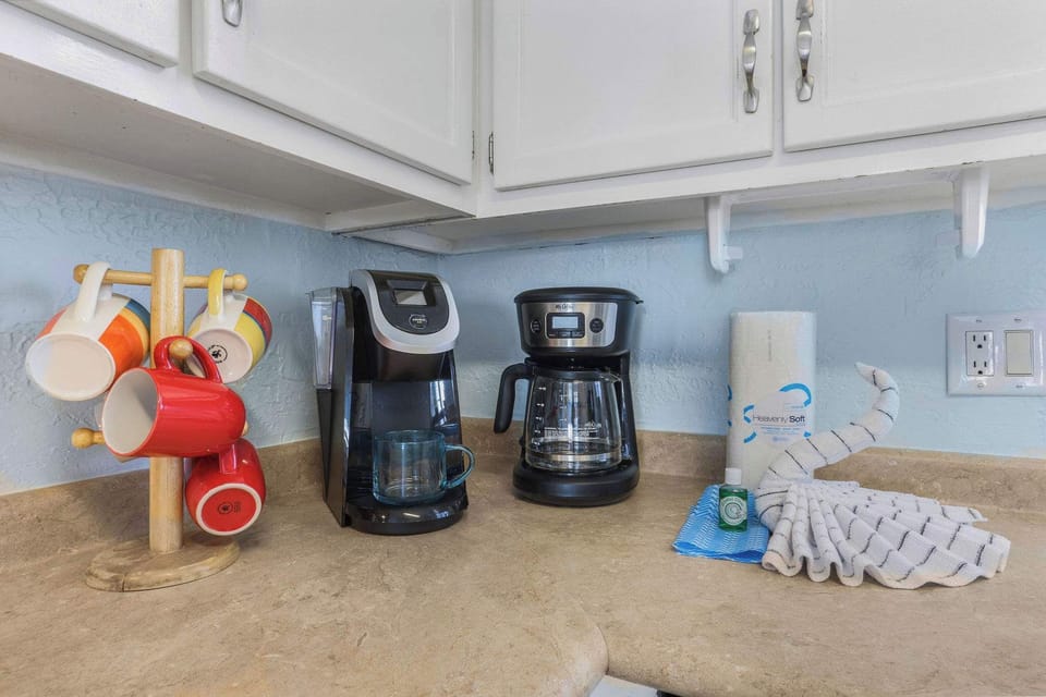 A regular coffee maker and a Keurig. 
