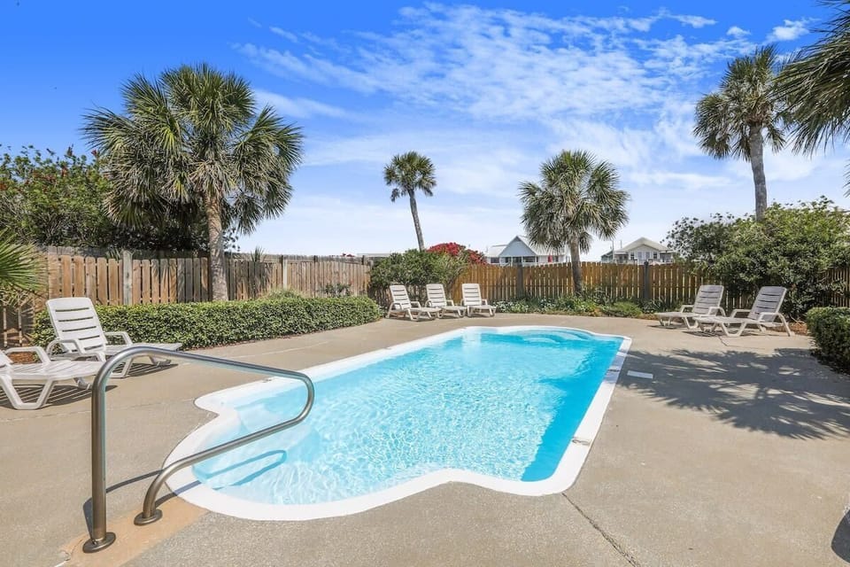 Pool, with expansive pool deck, is shared with guests of Side A. 