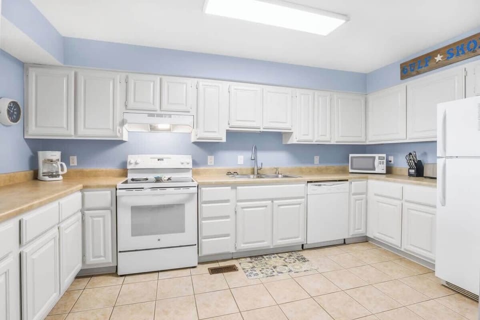 Spacious well-equipped kitchen. This condo offers a regular coffee maker. 