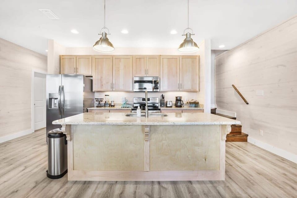 Island kitchen with stainless appliances